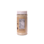 Jar of almond butter with a white lid on a white background