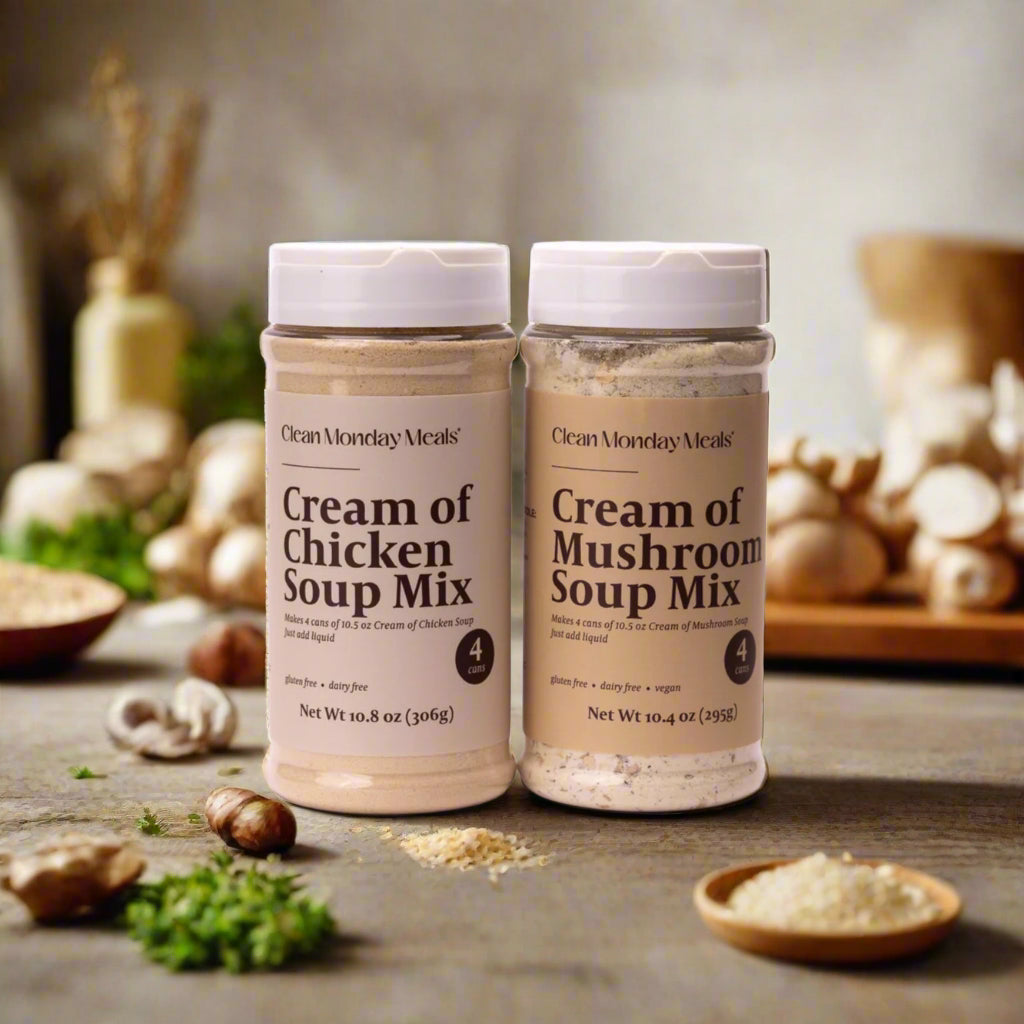Two jars of 'Clean Monday Meals' cream of chicken and mushroom soup mix on a white background