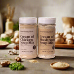 Two jars of 'Clean Monday Meals' cream of chicken and mushroom soup mix on a white background