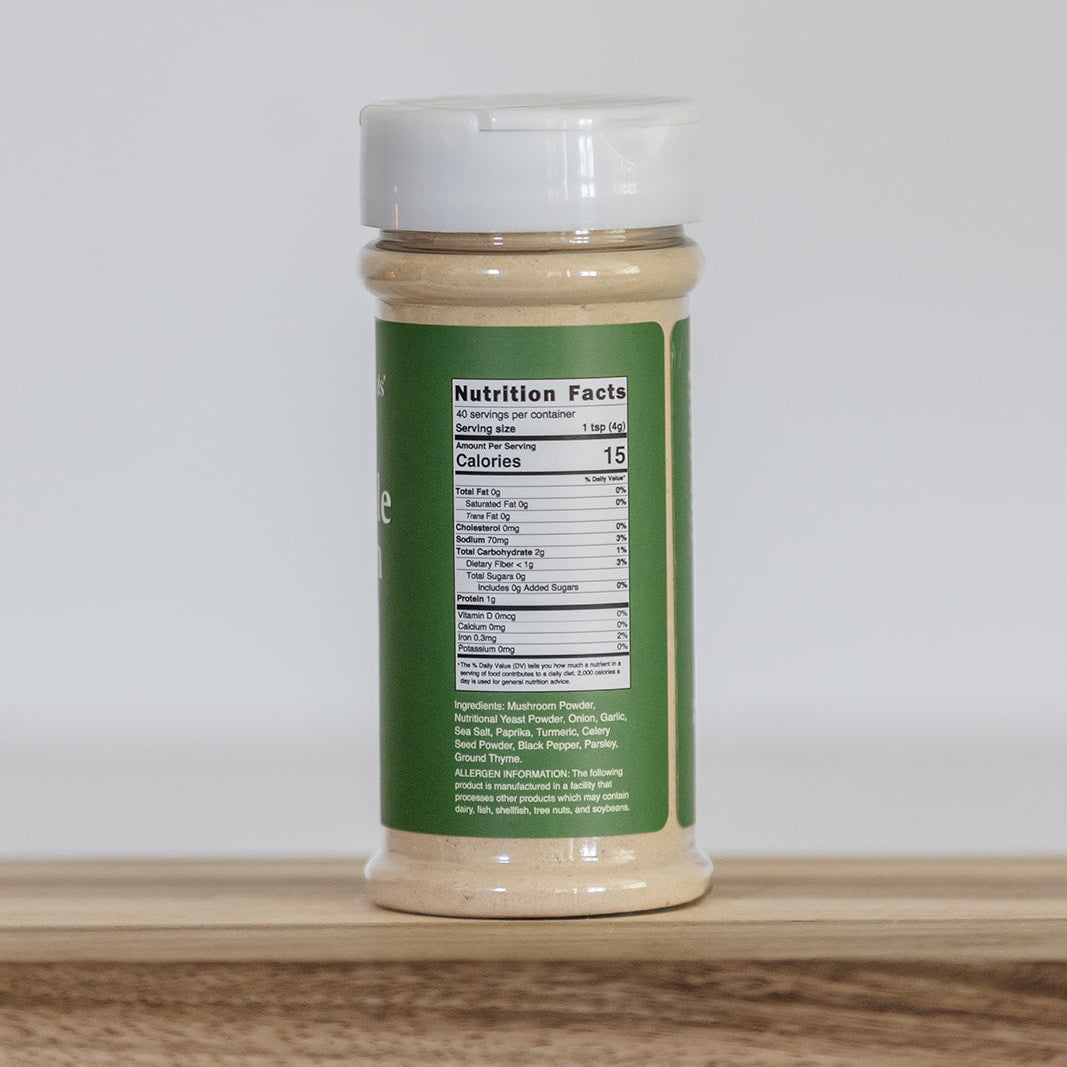 Clean Monday Meals Vegetable Bouillon showing the Nutrition Fact Panel on a wooden surface. 