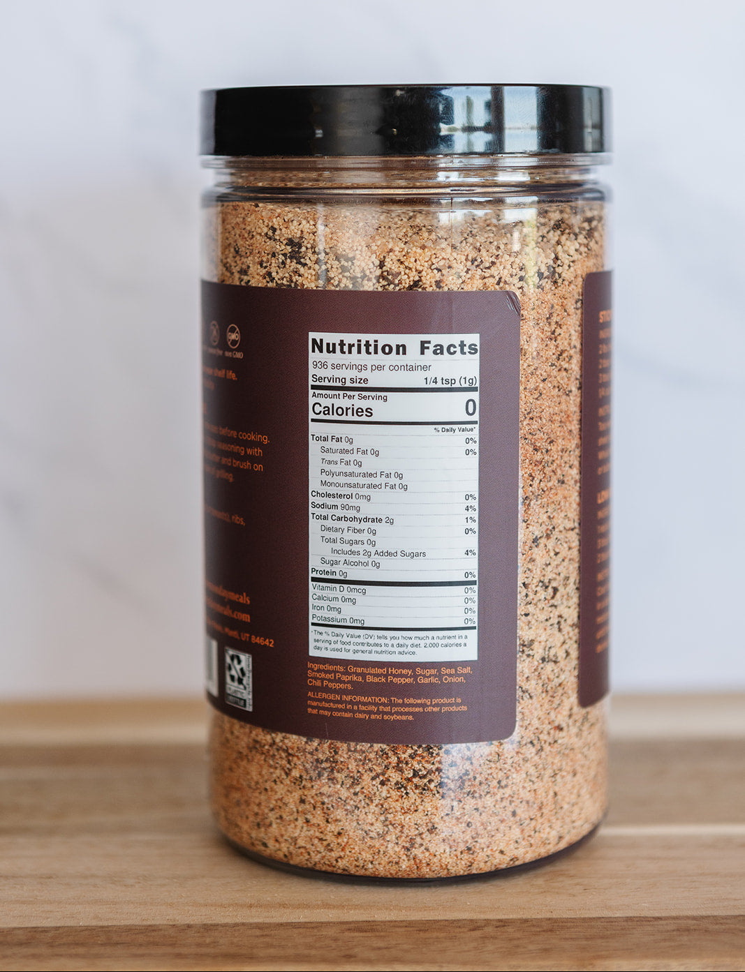 Spice jar with a nutrition label on a wooden surface