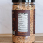 Spice jar with a nutrition label on a wooden surface