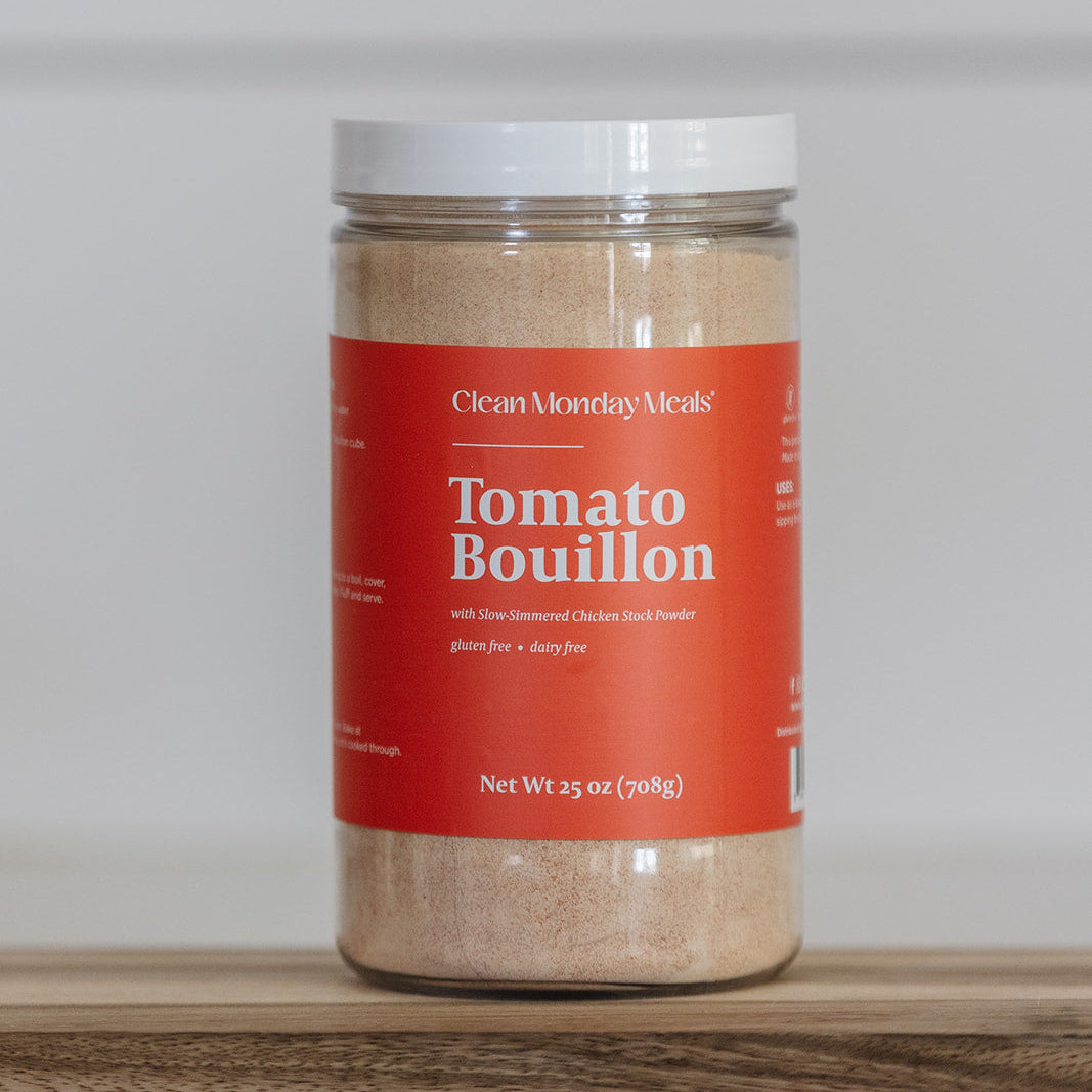 Jar of Clean Monday Meals Tomato Bouillon on a wooden surface and white background. 