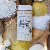 Container of 'Cream of Chicken Soup Mix' surrounded by various ingredients on a wooden surface
