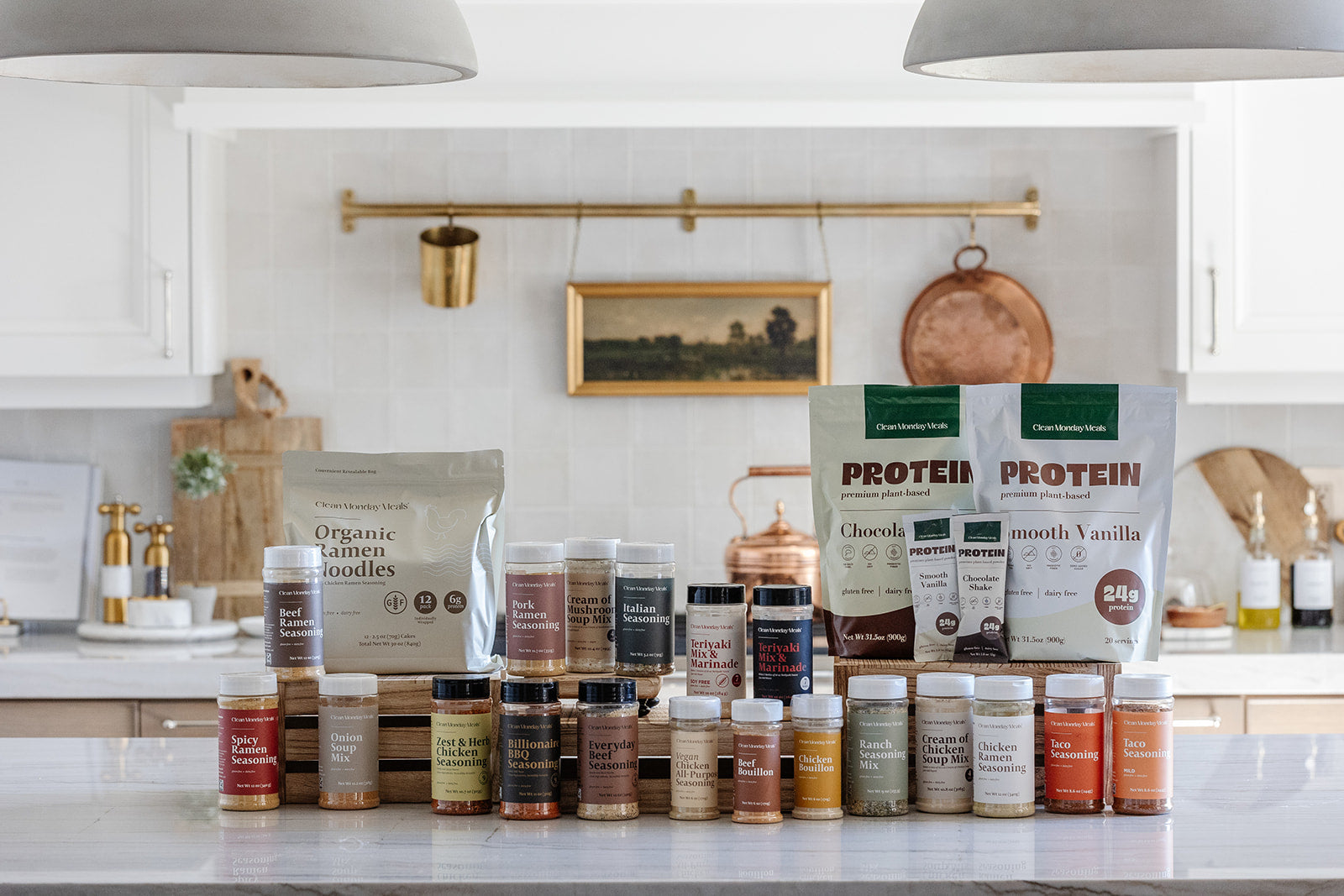All of Clean Monday Meals products on beautiful cozy kitchen counter 