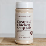 Jar of 'Cream of Chicken Soup Mix' by Clean Monday Meats on a wooden surface with a white background