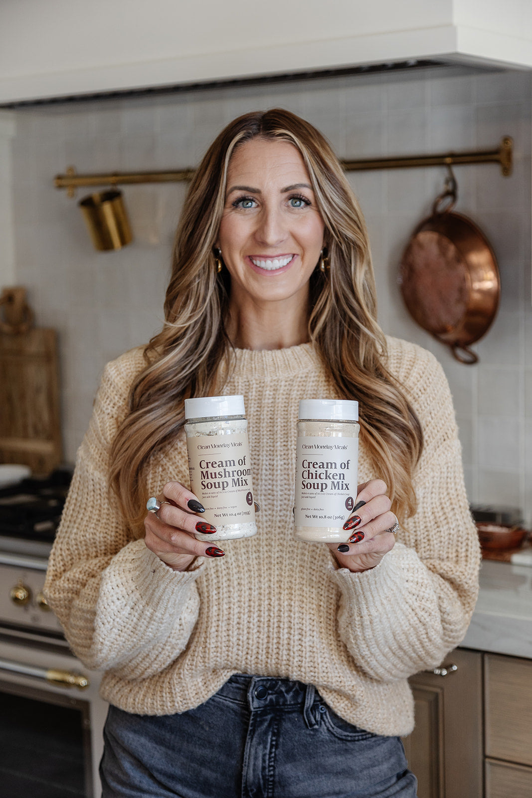 Janae Cox holding a jar of cream of chicken soup mix and cream of mushroom soup mix 